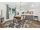 This dining room features a modern light fixture and decor, and a beautiful decorative rug at 2296 N Shallowford Rd, Atlanta, GA 30341