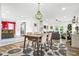Open concept living space with a dining table and open view to kitchen and living room at 2296 N Shallowford Rd, Atlanta, GA 30341