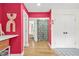 Bright hallway with hardwood floors, closet, leading to a bedroom with decorative curtain at 2296 N Shallowford Rd, Atlanta, GA 30341