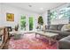 Bright living room with comfortable seating, modern shelving, and access to the backyard at 2296 N Shallowford Rd, Atlanta, GA 30341