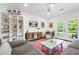 Bright living room with comfortable seating, modern shelving, and access to the backyard at 2296 N Shallowford Rd, Atlanta, GA 30341