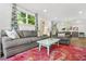 This bright living room boasts a plush sofa and comfortable seating at 2296 N Shallowford Rd, Atlanta, GA 30341