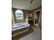 Bathroom featuring a large soaking tub and double vanity at 3502 Tiffany Se Dr, Conyers, GA 30013