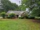 Charming single-story home featuring a brick facade and mature landscaping at 3502 Tiffany Se Dr, Conyers, GA 30013