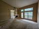 Spacious living room with fireplace and large windows providing lots of natural light at 3502 Tiffany Se Dr, Conyers, GA 30013