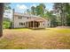 Spacious backyard with covered deck, and lush landscaping at 3702 Running Fox Dr, Marietta, GA 30062