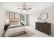 Comfortable bedroom featuring soft decor, a ceiling fan, and a window for lots of light at 3702 Running Fox Dr, Marietta, GA 30062