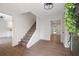 Bright entryway with hardwood floors, a staircase, and access to other rooms in the home at 3702 Running Fox Dr, Marietta, GA 30062