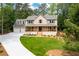 Charming two-story home with a welcoming front porch and a spacious three-car garage at 3702 Running Fox Dr, Marietta, GA 30062