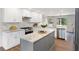 Modern kitchen with stainless steel appliances, white cabinets, and center island at 3702 Running Fox Dr, Marietta, GA 30062