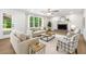 Cozy living room featuring a fireplace, ceiling fan, and lots of natural light at 3702 Running Fox Dr, Marietta, GA 30062