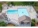 Community pool area featuring ample seating, umbrellas, lifeguard, and lounge areas at 3702 Running Fox Dr, Marietta, GA 30062