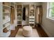 Organized walk-in closet provides ample storage space for clothing and accessories at 3702 Running Fox Dr, Marietta, GA 30062