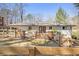 Charming backyard featuring a wooden deck, fence, and a well-maintained lawn, perfect for outdoor relaxation and entertainment at 46 Cooper Lake Sw Rd, Mableton, GA 30126