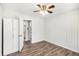 Bedroom with white wood paneling, new floors, and ceiling fan at 46 Cooper Lake Sw Rd, Mableton, GA 30126