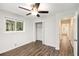 Bedroom with white walls, new floors, ceiling fan, and hallway view at 46 Cooper Lake Sw Rd, Mableton, GA 30126