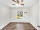 Bright bedroom featuring hardwood floors, a ceiling fan, and a large window at 46 Cooper Lake Sw Rd, Mableton, GA 30126