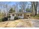 Charming single-story home with a well-manicured lawn and attached carport at 46 Cooper Lake Sw Rd, Mableton, GA 30126