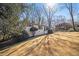Charming single-story home with manicured lawn, landscaping and mature trees at 46 Cooper Lake Sw Rd, Mableton, GA 30126