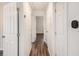 Hallway with wood-look floors leads to various rooms in the house at 46 Cooper Lake Sw Rd, Mableton, GA 30126