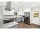 Modern kitchen with granite countertops, stainless appliances, white subway tile, and gas cooktop at 46 Cooper Lake Sw Rd, Mableton, GA 30126