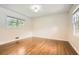 Well-lit bedroom featuring beautiful hardwood floors and two windows at 739 Pinehill Se Dr, Smyrna, GA 30080