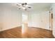 Bright bedroom with hardwood floors, closet, and ceiling fan with light at 739 Pinehill Se Dr, Smyrna, GA 30080