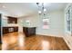 Bright dining area adjoining the kitchen boasts hardwood floors and ample natural light, perfect for Gathering meals at 739 Pinehill Se Dr, Smyrna, GA 30080