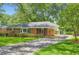 Inviting single-story home with a covered carport and well-maintained landscaping at 739 Pinehill Se Dr, Smyrna, GA 30080