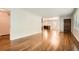 Hardwood floors flow through the open-concept living area, connecting the kitchen and dining spaces with seamless elegance at 739 Pinehill Se Dr, Smyrna, GA 30080