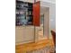 Charming home bar area with storage cabinets and mirrored shelves for showcasing glassware and liquor bottles at 11785 Mountain Laurel Dr, Roswell, GA 30075