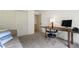 Cozy bedroom featuring a desk, sofa, and neutral decor at 11785 Mountain Laurel Dr, Roswell, GA 30075