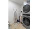 Modern laundry room features new washer and dryer with tile flooring at 11785 Mountain Laurel Dr, Roswell, GA 30075