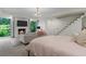 Spacious main bedroom includes a fireplace, sitting area, and large windows at 11785 Mountain Laurel Dr, Roswell, GA 30075