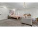 Spacious main bedroom with a sitting area, closet, and accent lighting at 11785 Mountain Laurel Dr, Roswell, GA 30075