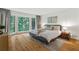 Spacious main bedroom with hardwood floors, large windows, and natural light at 11785 Mountain Laurel Dr, Roswell, GA 30075