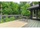 Outdoor patio with furniture provides peaceful view of natural surroundings at 11785 Mountain Laurel Dr, Roswell, GA 30075