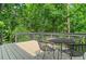 Outdoor patio with furniture provides peaceful view of natural surroundings at 11785 Mountain Laurel Dr, Roswell, GA 30075