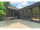 Charming outdoor patio with furniture and view of backyard and trees at 11785 Mountain Laurel Dr, Roswell, GA 30075