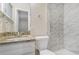Modern bathroom featuring granite vanity and tile shower at 2083 Green Forrest Dr, Decatur, GA 30032