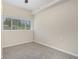 Bright bedroom featuring neutral carpet, natural light, and blinds for privacy at 2083 Green Forrest Dr, Decatur, GA 30032