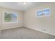 Bedroom featuring neutral carpet and natural light from two windows at 2083 Green Forrest Dr, Decatur, GA 30032