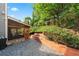 Landscaped backyard with a charming screened-in porch and lush greenery providing a private retreat at 2412 Boulder Se Rd, Atlanta, GA 30316