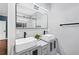 Stylish bathroom featuring double vessel sinks, contemporary vanity and a large frameless mirror at 2412 Boulder Se Rd, Atlanta, GA 30316