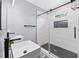 Modern bathroom features a vessel sink and walk-in shower with stylish black hardware and sleek tile at 2412 Boulder Se Rd, Atlanta, GA 30316