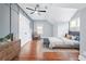 Bright bedroom featuring hardwood floors, accent wall and large windows offering scenic views at 2412 Boulder Se Rd, Atlanta, GA 30316