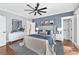 Stylishly furnished bedroom with a large bed, accent wall, ceiling fan and ample natural light at 2412 Boulder Se Rd, Atlanta, GA 30316