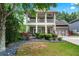 Charming two-story home with a welcoming porch, landscaped yard, and a two-car garage at 2412 Boulder Se Rd, Atlanta, GA 30316