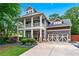 Stately two-story home featuring a covered front porch, two-car garage, and beautifully landscaped front yard at 2412 Boulder Se Rd, Atlanta, GA 30316