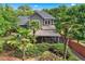 Stunning two-story home featuring lush landscaping, screened-in porch, and mature trees, set in a desirable location at 2412 Boulder Se Rd, Atlanta, GA 30316